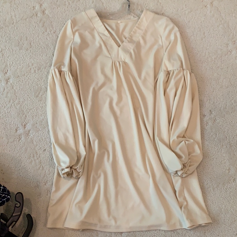 Cream dress. Poly blend.